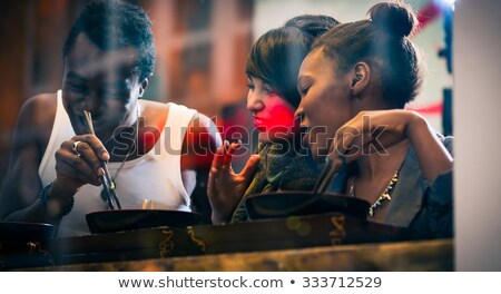 ストックフォト: Man And Women Eating Late In Korean Eatery