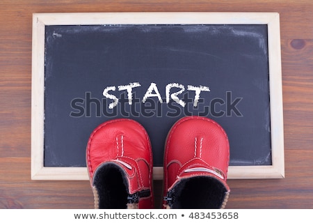 Foto stock: Kid Shoes And Word Strategy