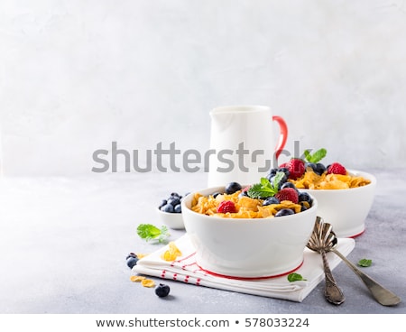 Stock photo: Bowl Of Corn Flakes And Jug Of Milk