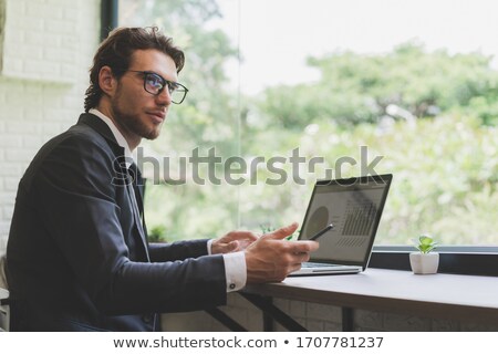 Foto stock: European Businessman Working At Laptop