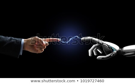 Foto stock: Robot And Human Hand Connected By Lightning