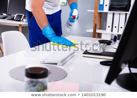 Stock photo: Janitor With Mop Cleaning Office