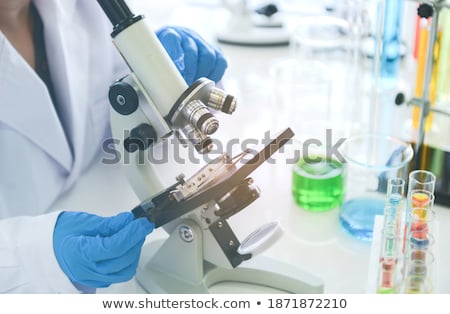 Foto d'archivio: Old Female Biotechnology Chemist Working In The Lab