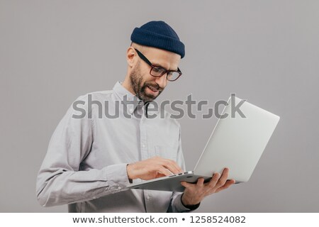 Foto stock: Concentrated Bearded Male Administrative Worker Coordinates Work On Distance Searches Information O