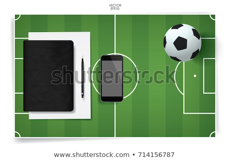 ストックフォト: Football And Blank Notebook On Green Grass