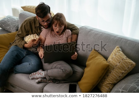 Stock photo: Woman Sitting On A Mans Lap