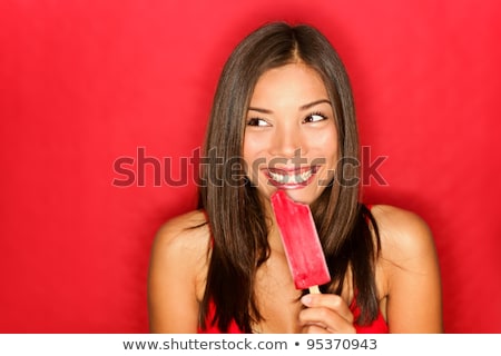 Girl Eating Ice Lolly Stock fotó © Ariwasabi