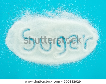 [[stock_photo]]: The Word Sugar Written Into A Pile Of White Granulated Sugar