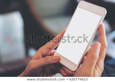 Foto d'archivio: Modern Smart Phone With Blank Screen On The Wooden Table