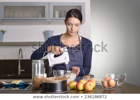 Foto stock: Housewife Preparing With Kitchen Mixer