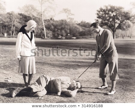 Stock foto: Ball For Golf Lies On An Ear At The Man