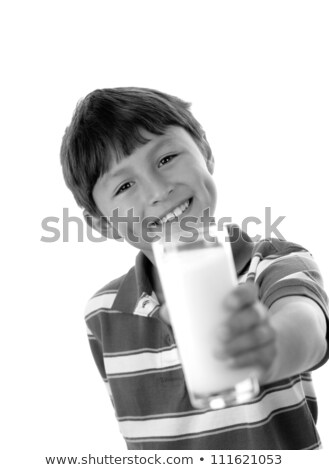 Stok fotoğraf: Boy Offering Us A Glass Of Milk