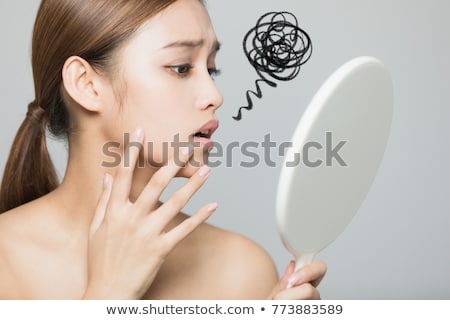 Stock foto: Checking Her Blemishes