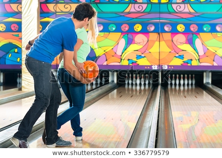Man Teaching Woman Bowling Stockfoto © Kzenon
