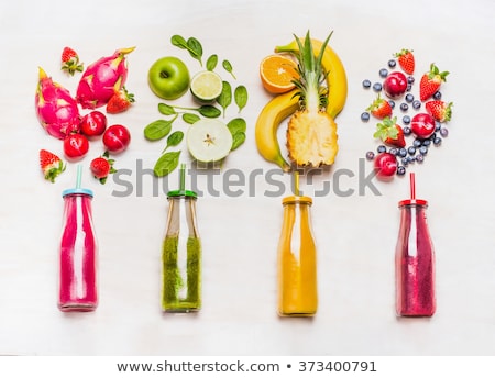 Foto stock: Fresh Juices Or Smoothies With Fruits And Vegetables In Wooden T