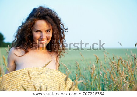 ストックフォト: Topless Woman With Hat Before Her Chest