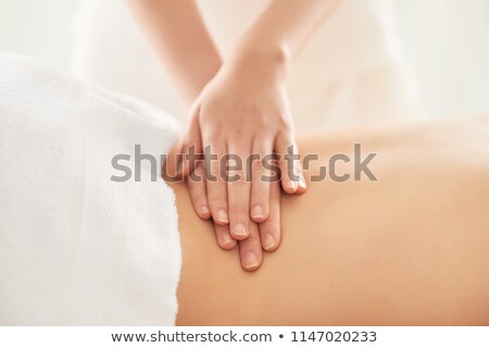 Stock fotó: Therapist Massaging Loin Of Client