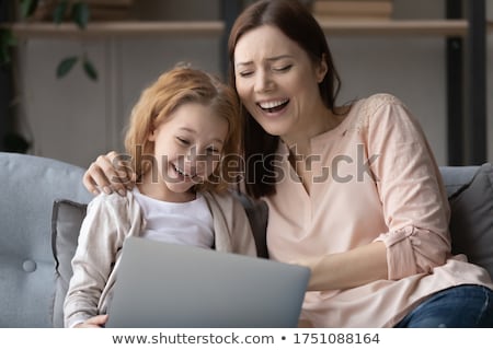 Stock fotó: Happy Mother And Daughter Using The Laptop