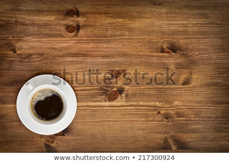 Foto d'archivio: Hot Fresh Coffee In A White Cup With Sugar On Wooden Table