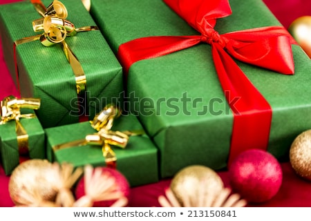 Four Golden Bows Around Wrapped Presents Stockfoto © LeoWolfert