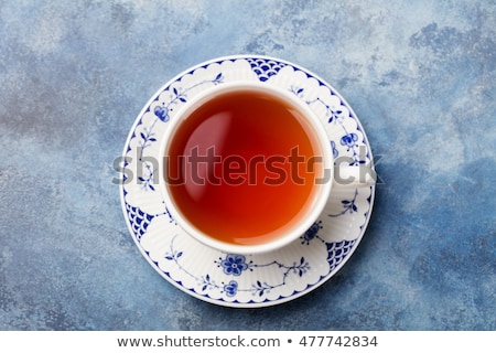 Сток-фото: Cup Of Tea On A Blue Stone Background Top View