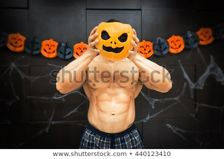 Stock fotó: Halloween Bodybuilder With Pumpkin