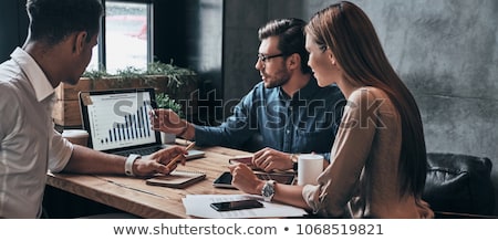 Stock fotó: Group Of Business People Analyzing Data