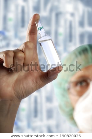 Stockfoto: Pharmacist Checking A Chemical Pharmaceutical Substance In A Modern Drugstore