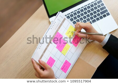 [[stock_photo]]: Business Woman Checking Agenda
