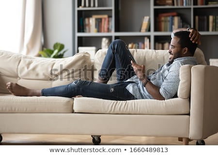 ストックフォト: Photo Of African American Man Playing Video Game On Smartphone