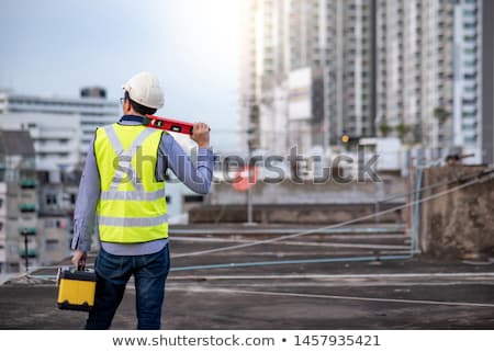 Stock photo: Man Holding Spirit Level