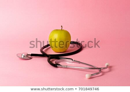 Сток-фото: Female Medic Checking The Pulse Of An Apple