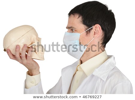 Student Medical School In Mask Looks At Skull Stockfoto © pzAxe