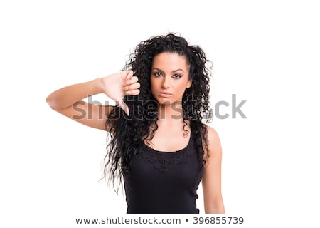 Stock fotó: Mad Young Girl With Thumb Down On White Background Studio