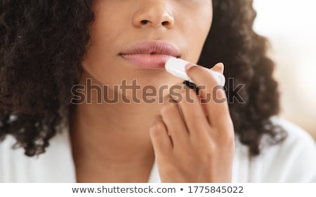 Stockfoto: Young Woman Lips And A Finger