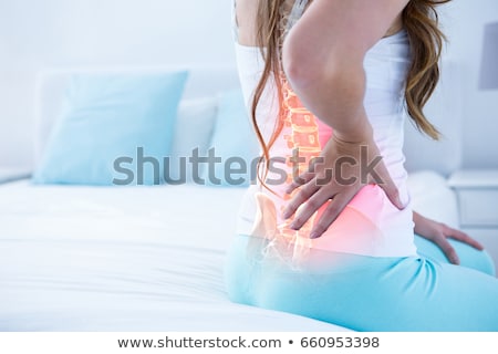 Stock photo: Woman Suffering From Back Pain