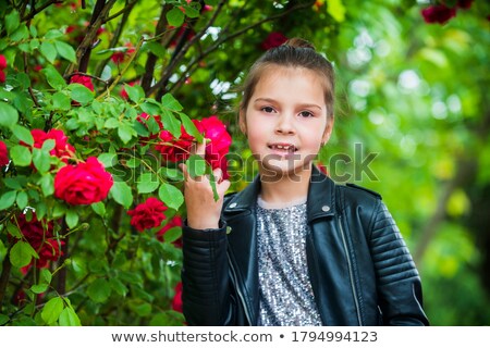 Stok fotoğraf: Baby Enjoying Flowers Aroma