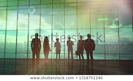 Foto stock: A Team Of Traders Is Exploring Infographics