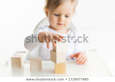 Foto stock: Little In Blocks On White