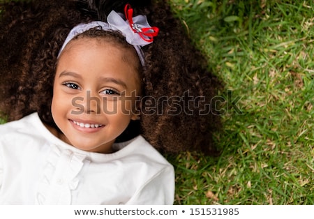 Foto stock: Portrait Of A Young Beautiful African American Girl Lied