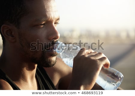 Stok fotoğraf: Young Sportsman Drinking Water