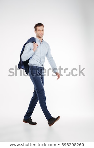 Foto stock: Vertical Image Of Man In Business Clothes Walking