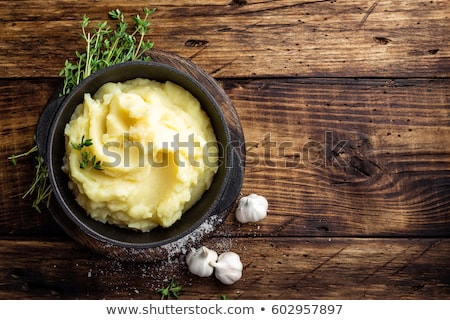 Stock photo: Mashed Potatoes Boiled Puree In Cast Iron Pot On Dark Wooden Rustic Background Top View