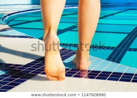 Zdjęcia stock: Bare Feet In Swimming Pool Water