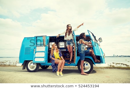 Foto stock: Hippie Man At Minivan Car On Road