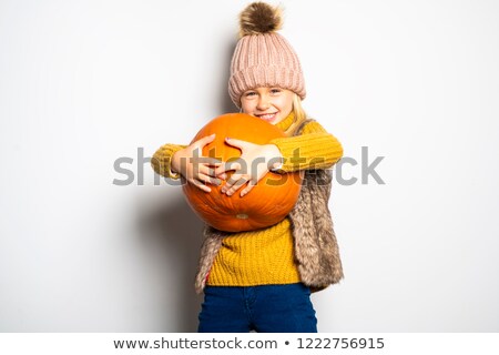 Stock fotó: A Cute Girl 5 Year Old Posing In Studio With Pumpkin