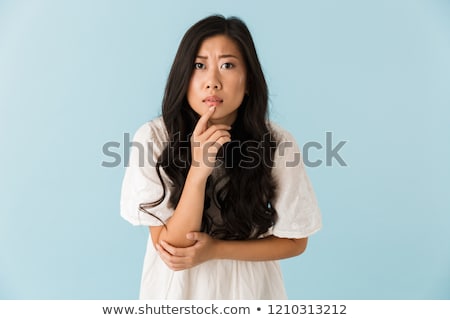 Zdjęcia stock: Scared Young Asian Beautiful Woman Posing Isolated Over Blue Background Pointing