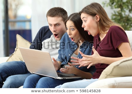 Foto stock: Amazing Three Friends Women Using Laptop Computer