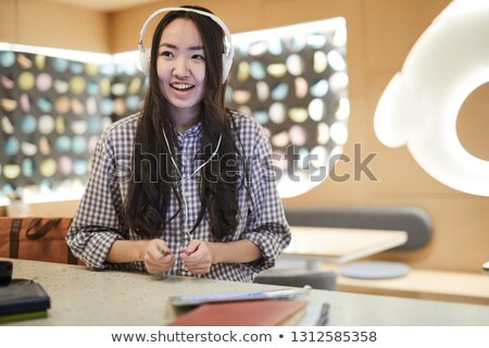 Stockfoto: Asian Student Enjoying Favorite Song