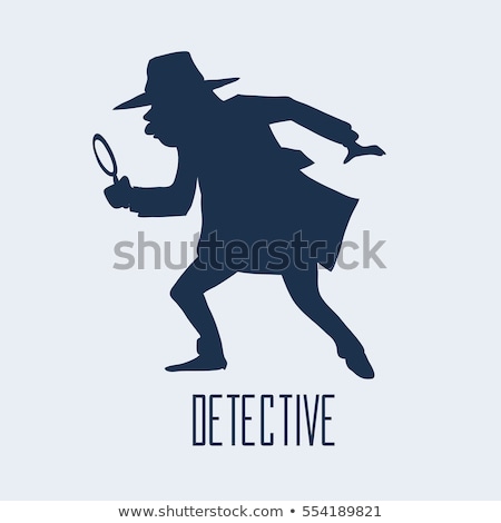 ストックフォト: Man With Raincoat Is Looking With Magnifying Glass